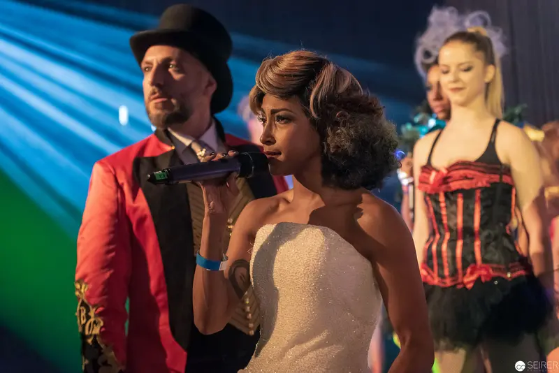 Vintage Cabaret Performance with Singer in Strapless Dress and Ringmaster