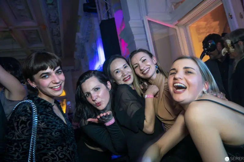 Vibrant Night Out: Five Young Women Celebrating at Nightclub Party