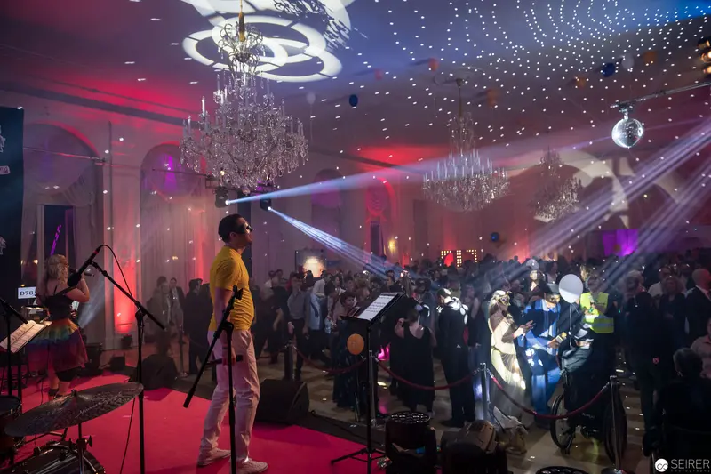 Musical Performance with Dynamic Lighting in Ornate Baroque-Style Performance Hall