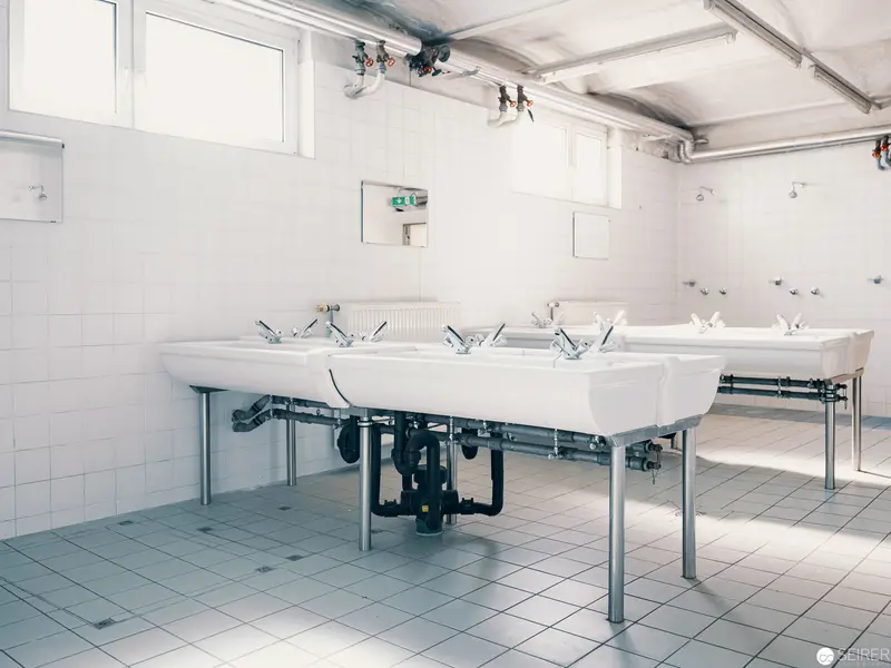Sterile White Utility Sinks in Institutional Architectural Interior