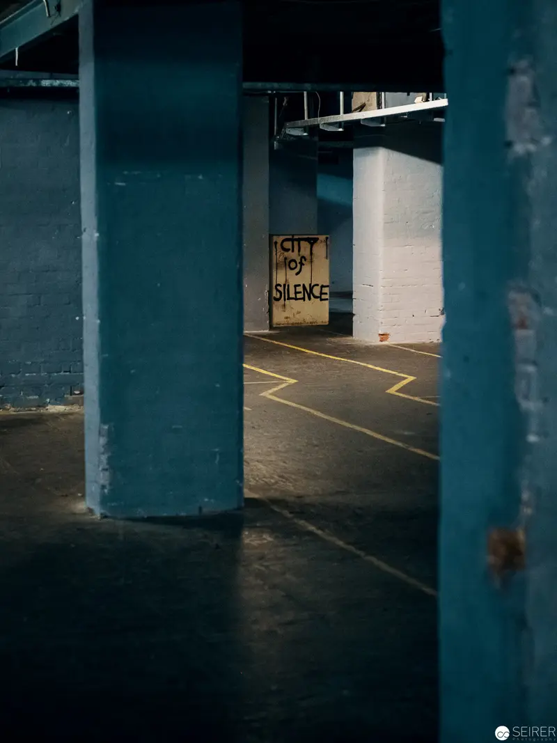 Urban Silence: Liminal Space with Provocative Street Art Sign