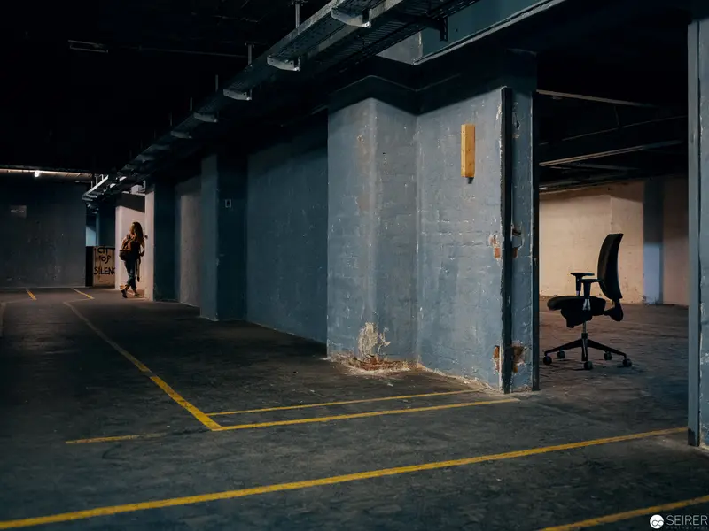 Solitary Office Chair in Empty Parking Garage with Mysterious Floor Marking
