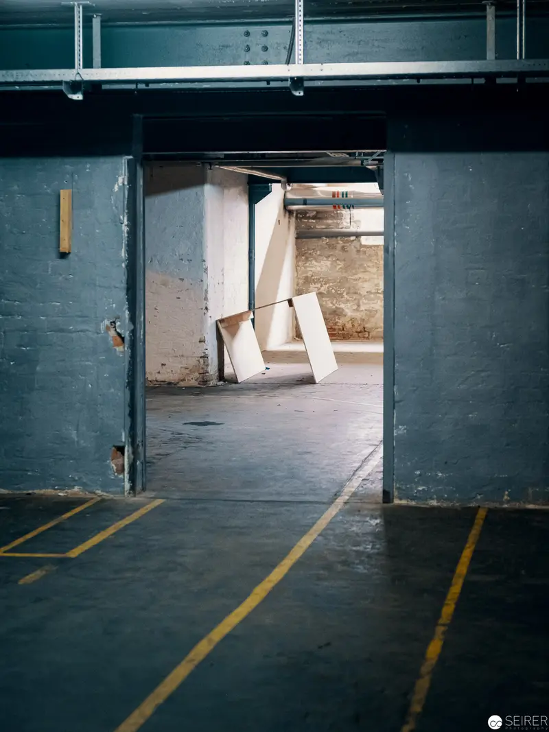 Industrial Passageway with Structural Doorway and Yellow Demarcation Lines