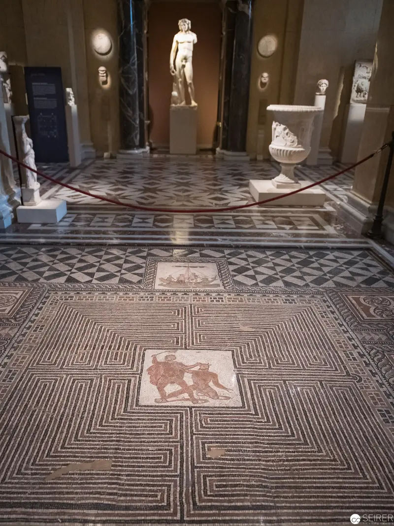 Roman Mosaic Floor with Labyrinthine Pattern and Classical Sculpture Display