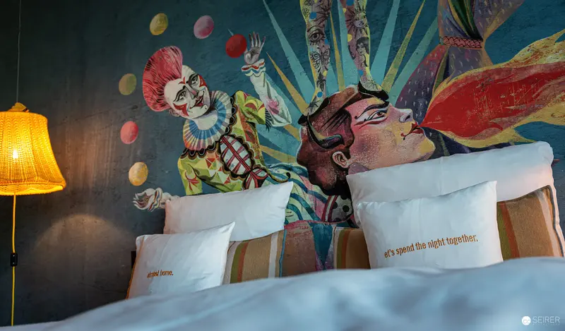 Surreal Hotel Room Mural with Colorful Circus and Fantasy Imagery
