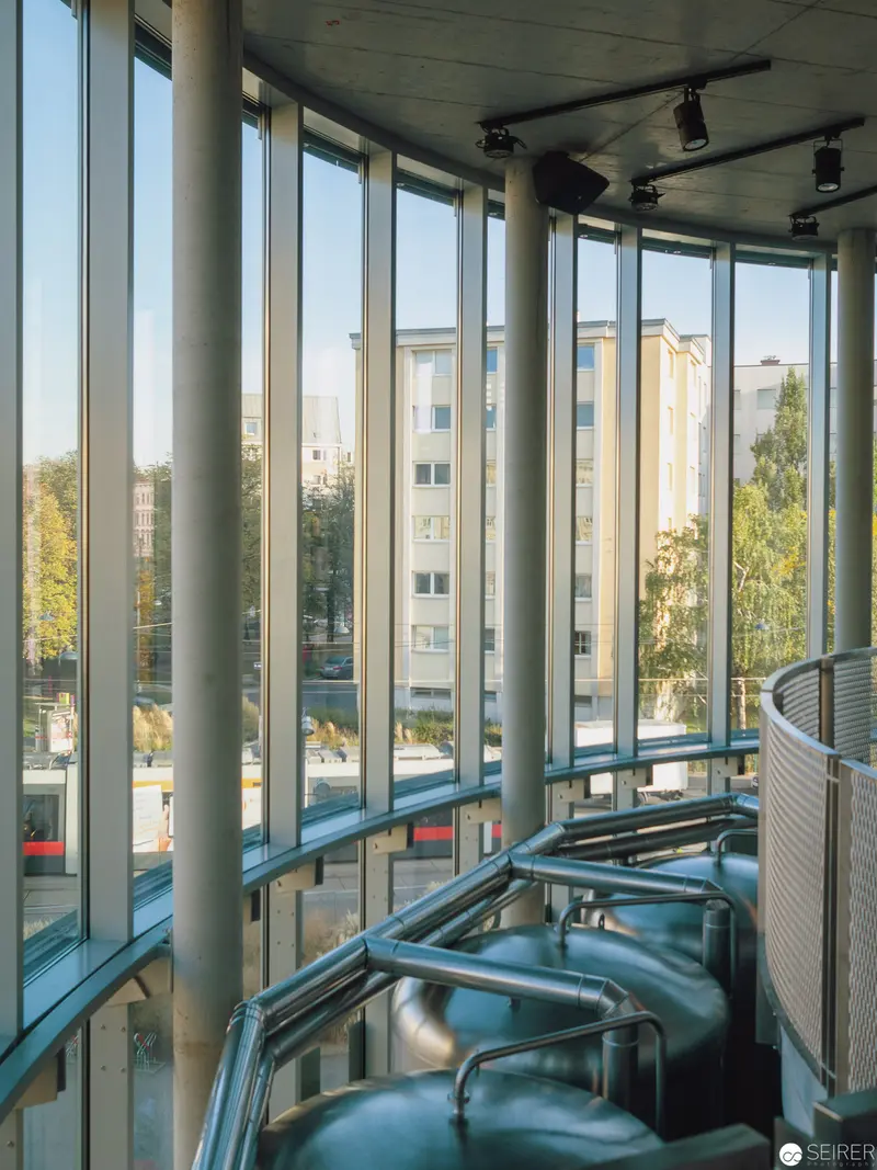 Curved Glass Corridor with Modern Urban Architectural Perspective