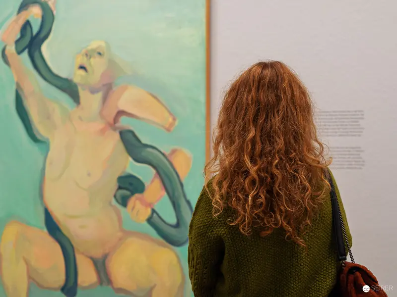 Maria Lassnig "Ways of Being" - Viewer Contemplating Expressive Nude Painting at Albertina