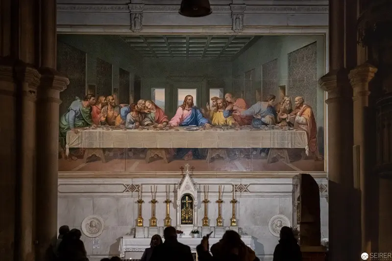 Leonardo da Vinci's Last Supper Reproduction with Observing Visitors in Architectural Setting