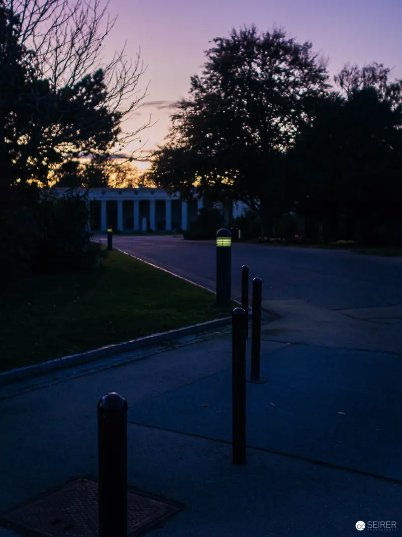 Twilight Path with Illuminated Bollard Along Urban Walkway