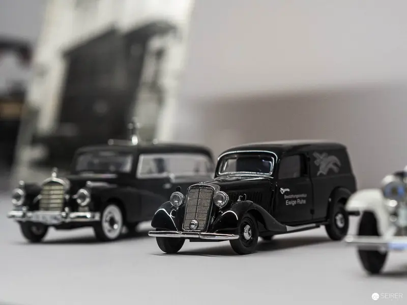 Vintage Miniature Black Automobile Models in Monochromatic Stilllife Composition