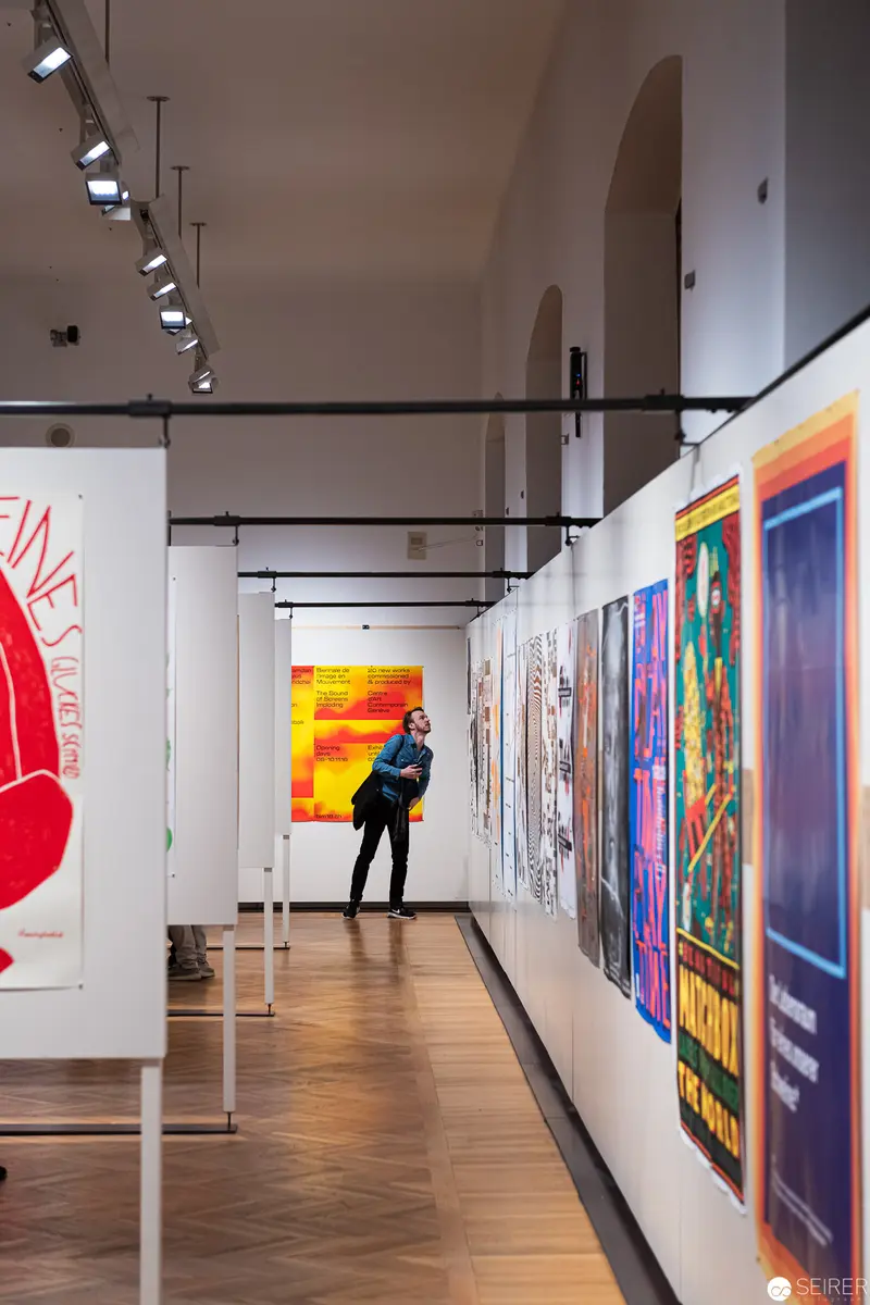 Solitary Viewer Amid Vibrant Modern Art Exhibition at MAK Wien