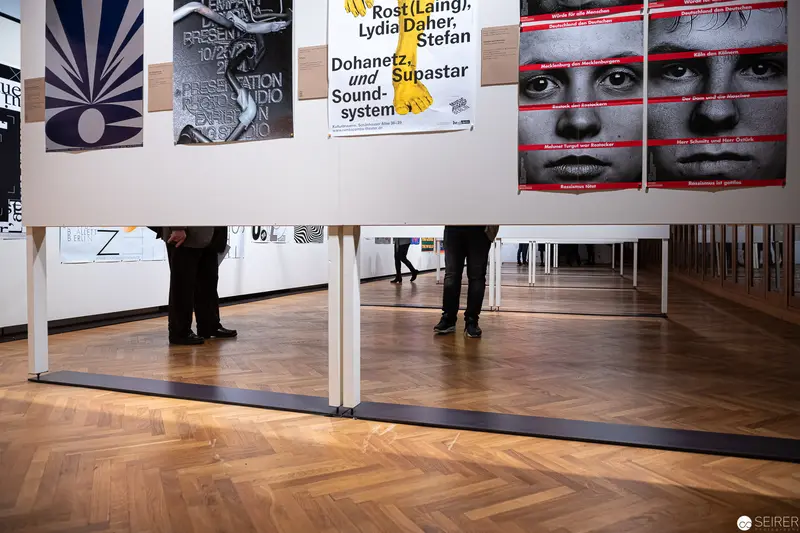 Exhibition Space at MAK Wien: Graphic Design Posters and Visitor Perspectives