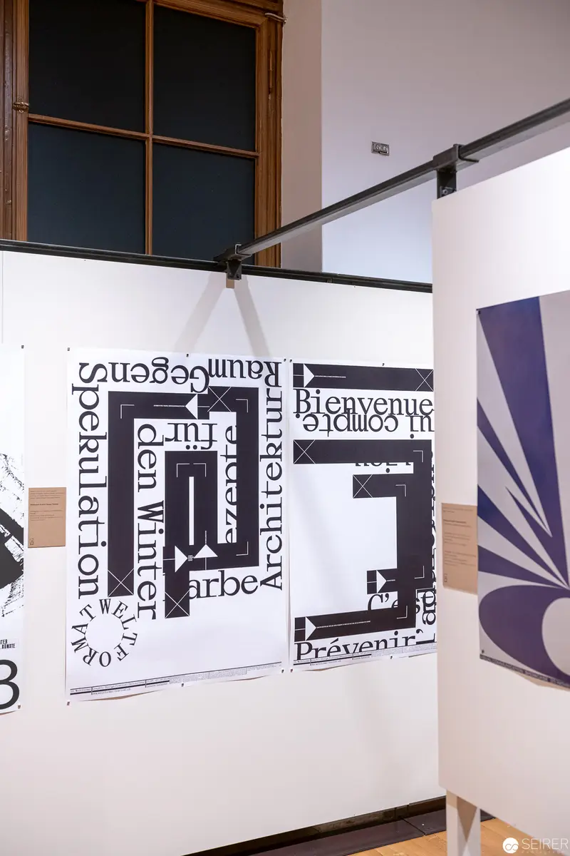 Typographic Composition with Layered Text and Architectural Elements at MAK