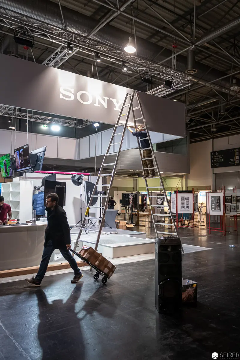 Sony Corporate Exhibition Setup with Worker Transporting Equipment on Dolly