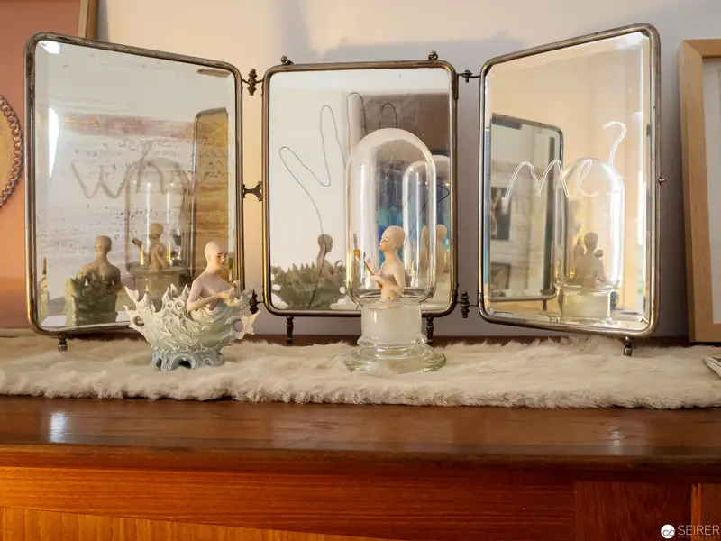 Triptych Mirror Display with Figurines and Glass Dome in Vintage Setting