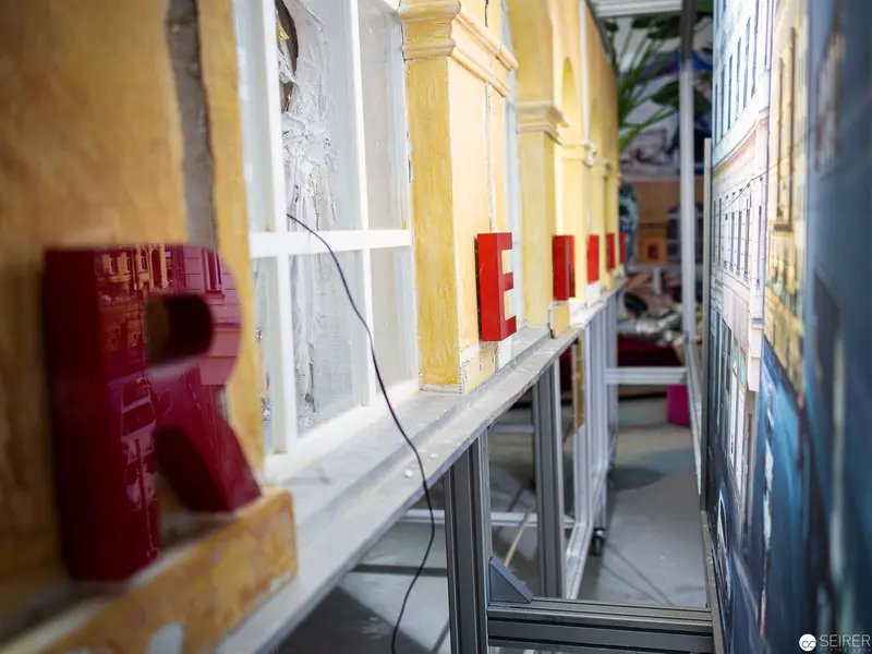 Interior Perspective with Red Architectural Elements and Yellow Wall Surfaces