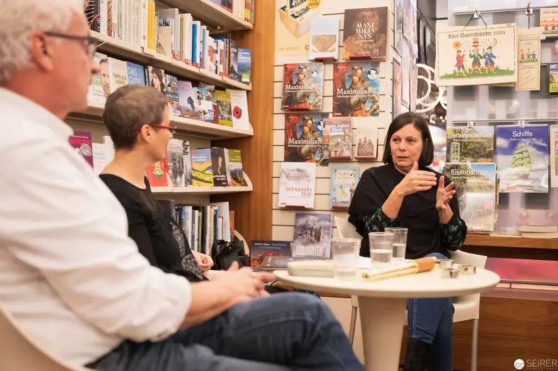 Book Reading and Author Discussion in Library Setting