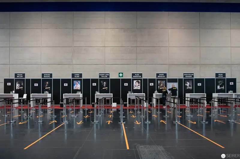 Airport Check-In Area with Social Distancing Markers and Staged Processing Stations