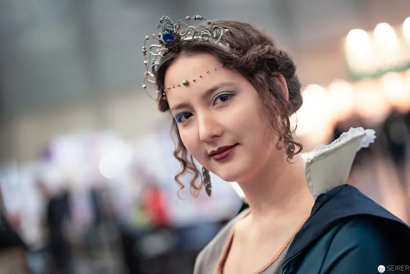 Costumed Attendee in Ornate Headdress at Vienna ComicCon 2019