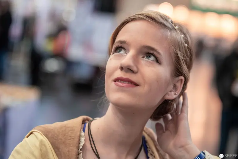 Young Woman in Contemplative Pose at Vienna ComicCon 2019