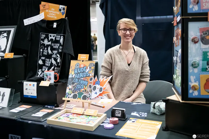 Artist at Vienna ComicCon 2019 Displaying Colorful Graphic Design and Illustration Portfolio