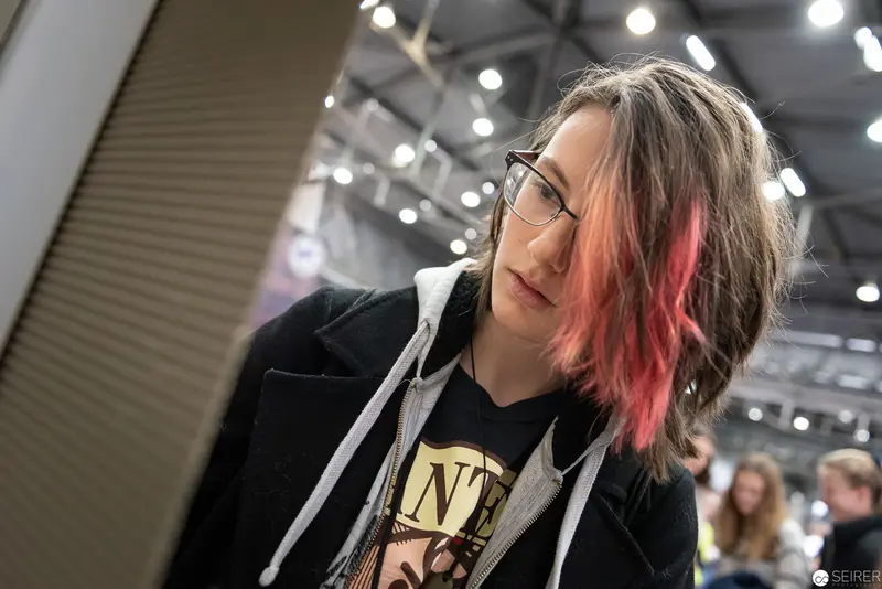 Young Attendee with Pink-Highlighted Hair at Vienna ComicCon 2019
