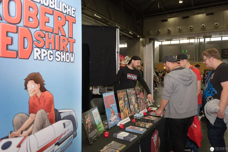 Robert Ed Shirt RPG Show Booth at Comic Convention Exhibition Space