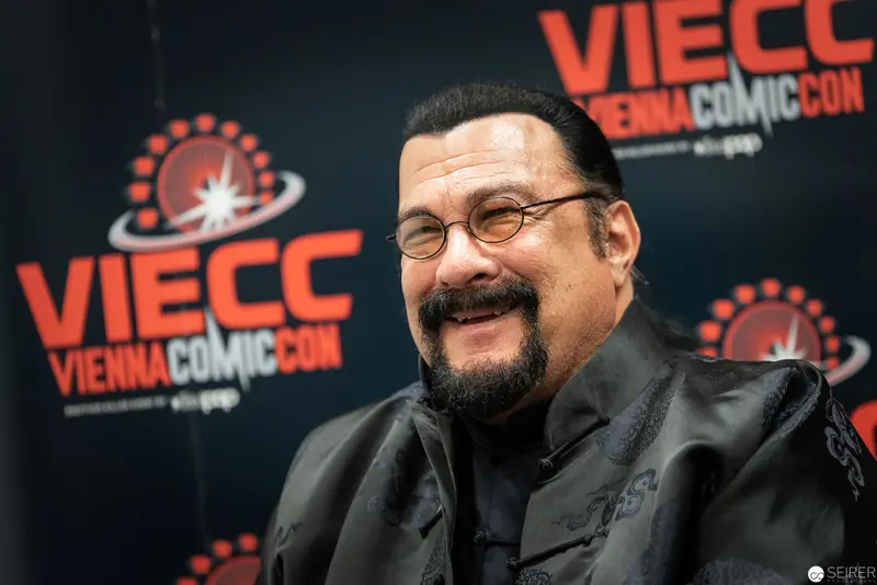 Steven Seagal at Vienna Comic Con 2019, Smiling in Black Attire