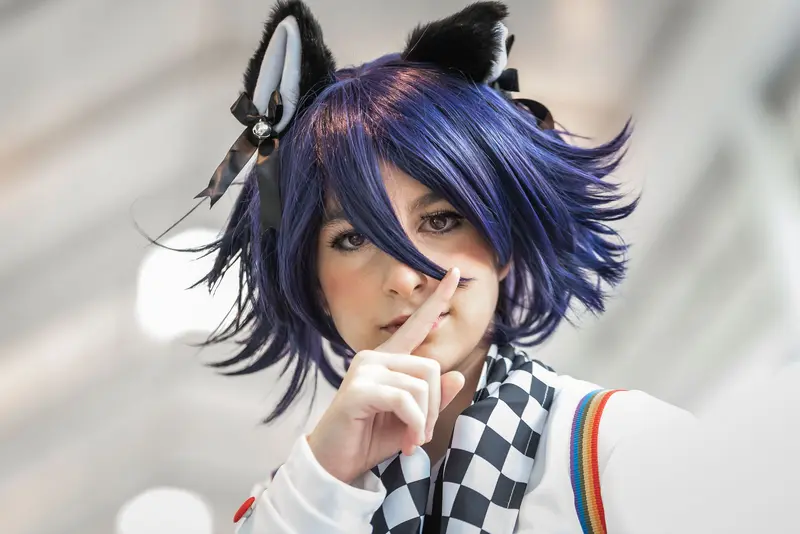 Vienna ComicCon 2019: Cosplayer with Blue Hair and Animal Ears Gestures Silently