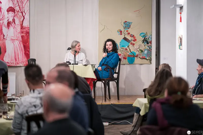Panel Discussion on Art and Culture with Seated Speakers in Gallery Space