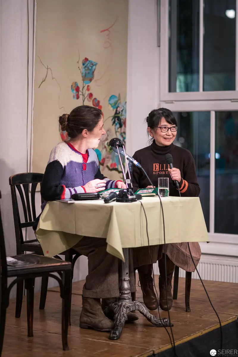 Evening Literary Discussion with Two Speakers at Public Reading Event