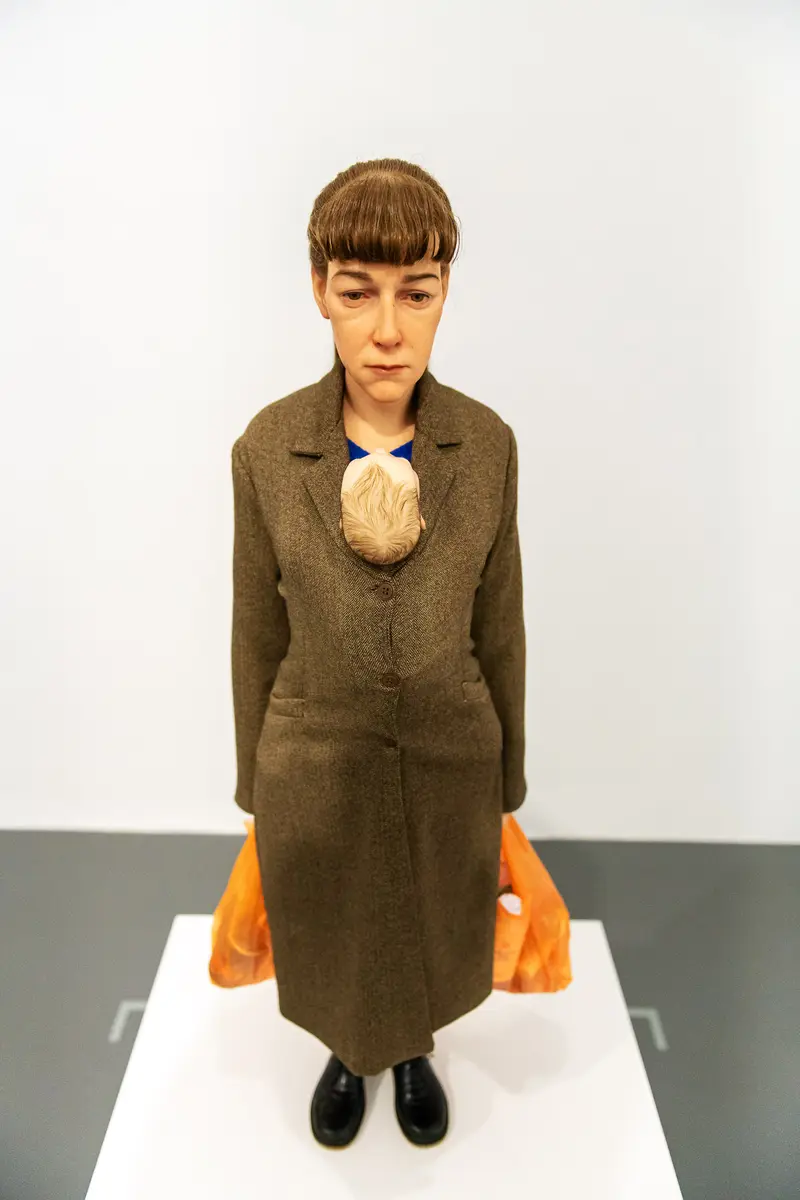 Sculptural Self-Portrait in Brown Coat at "Family Matters" Exhibition, Dom Museum Vienna