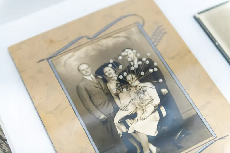 Vintage Portrait of Couple with Floral Bouquet in Formal Photographic Setting