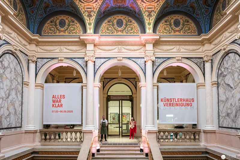 Künstlerhaus Vereinigung Wien Reopening: Architectural Interior with Exhibition Banners