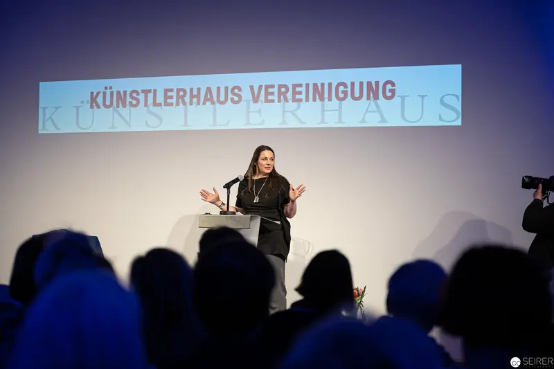 Künstlerhaus Vereinigung Speaker Gestures During Presentation at Vienna Event