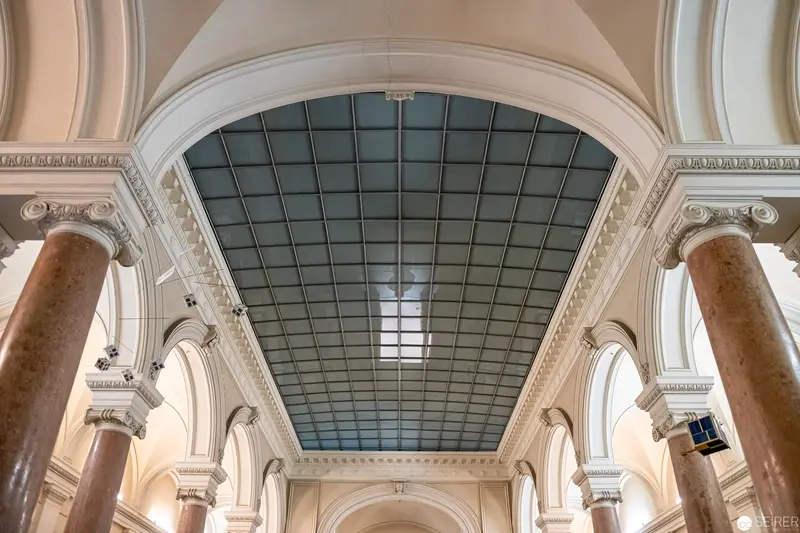Neoclassical Architectural Interior with Gridded Skylight and Marble Columns