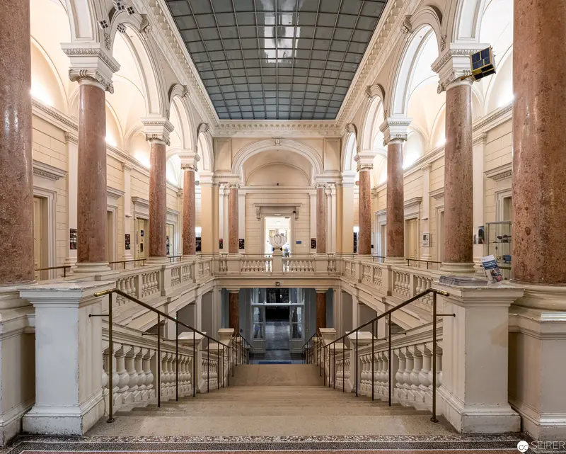 Neoclassical Interior of Grand Central Hall with Marble Columns and Dual Staircases