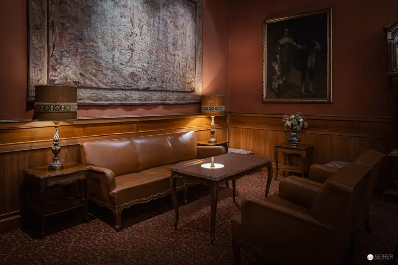 Intimate Study of Vintage Salon Interior with Leather Furnishings and Subdued Lighting