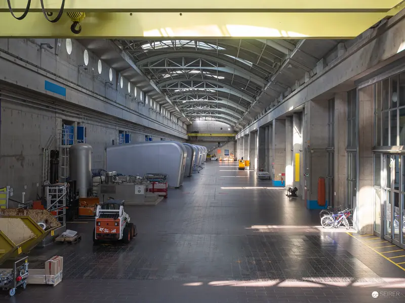 Industrial Interior of Kraftwerk Freudenau: Cavernous Machinery Hall with Ambient Lighting