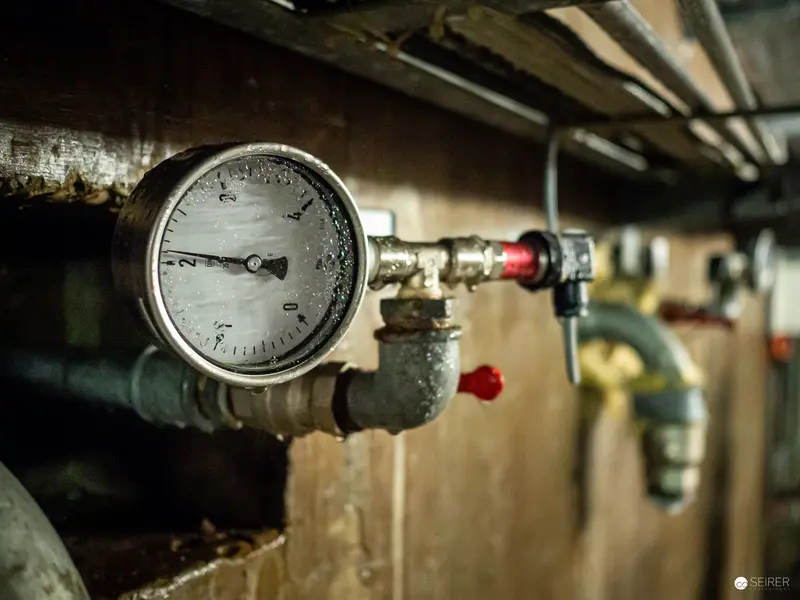 Industrial Pressure Gauge on Pipe Network at Kraftwerk Freudenau Utility Site