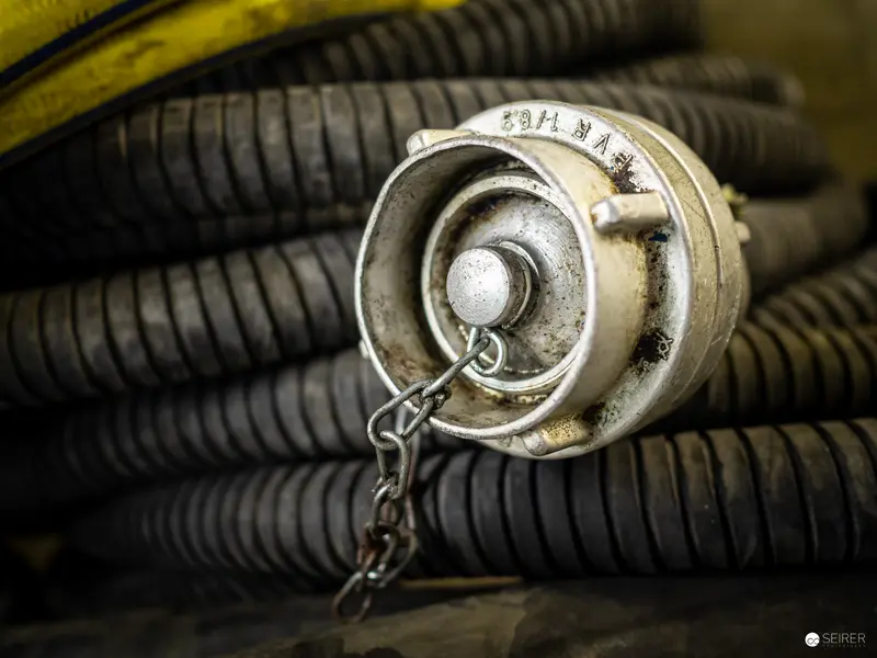 Industrial Coupling Detail with Corrugated Hose in Monochromatic Composition