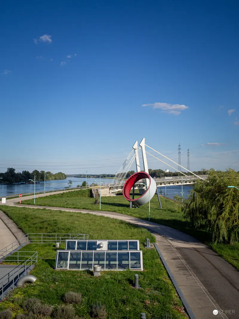 Architectural Landscape with Bridge and Solar Panels at Kraftwerk Freudenau