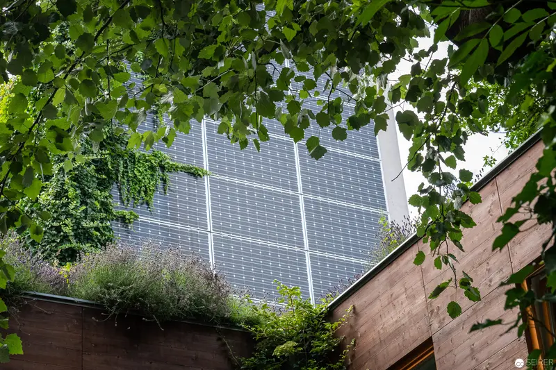 Sustainable Urban Design: Solar Panels and Greenery at Stadthalle Hotel, Vienna