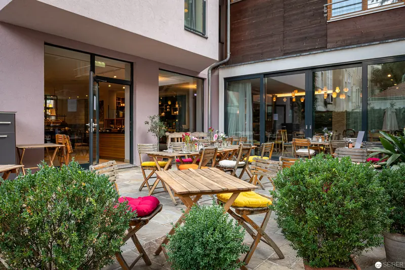 Outdoor Dining Patio at Boutiquehotel Stadthalle in Vienna's Green Urban Setting