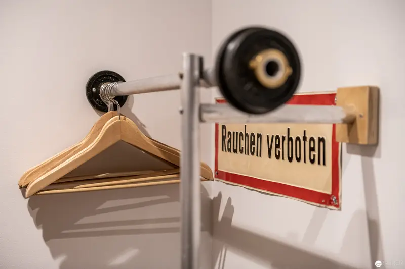 No Smoking Warning and Coat Rack at Stadthalle Hotel in Vienna