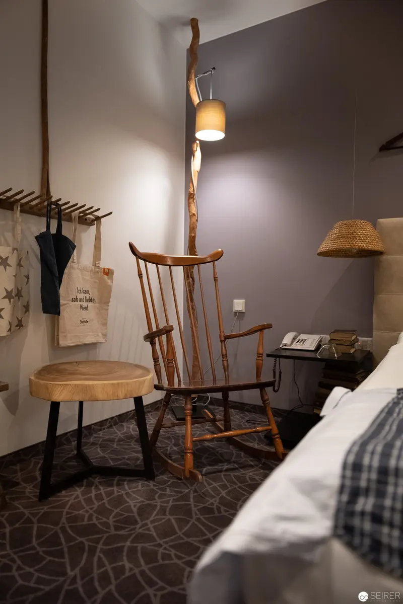 Rustic Rocking Chair in Minimalist Hotel Room Setting, Vienna Stadthalle