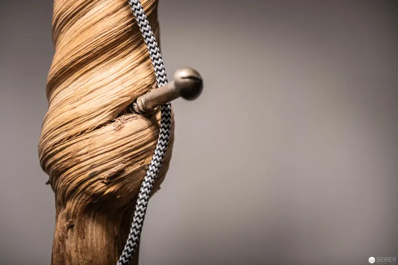 Intricately Twisted Wooden Form with Chevron Cord in Monochromatic Composition