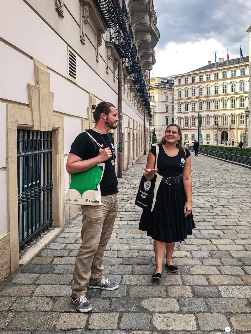 Urban Pedestrian Encounter on Cobblestone Street in Historic European City