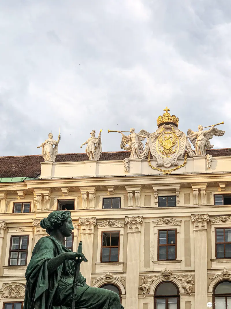 Baroque Architectural Sculpture at Hofburg Palace with Bronze Allegorical Figure