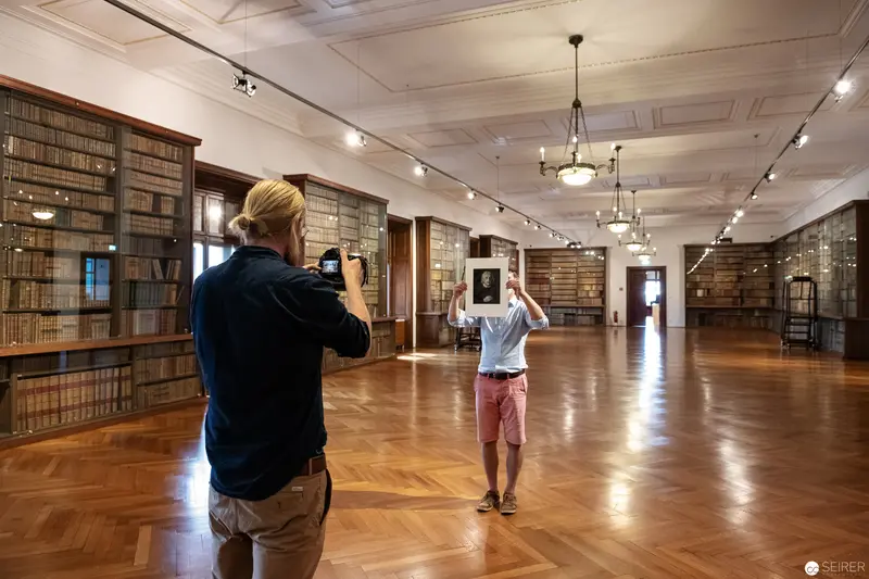 Researchers Documenting Interior of Ornate Library during Behind-the-Scenes Archival Tour